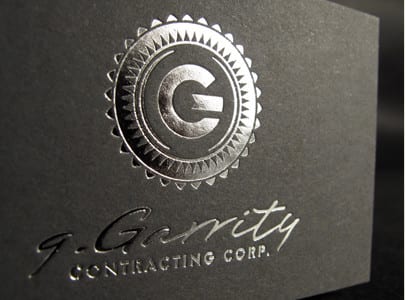 silver foil letterpress printed business card on grey paper