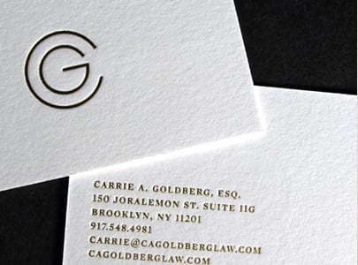 matte gold foil business card on white paper for Goldberg
