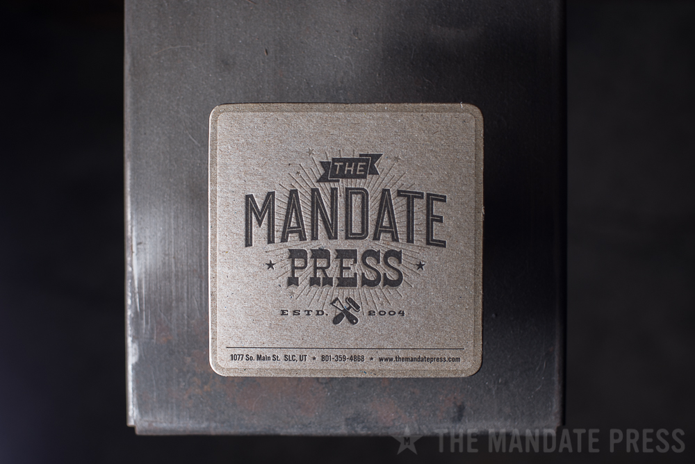 coaster on chipboard two color letterpress printed for The Mandate Press