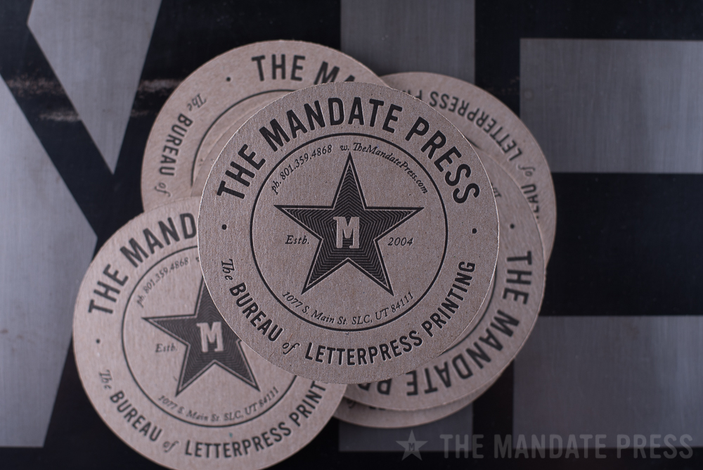round coaster letterpress printed for The Mandate Press on chipboard