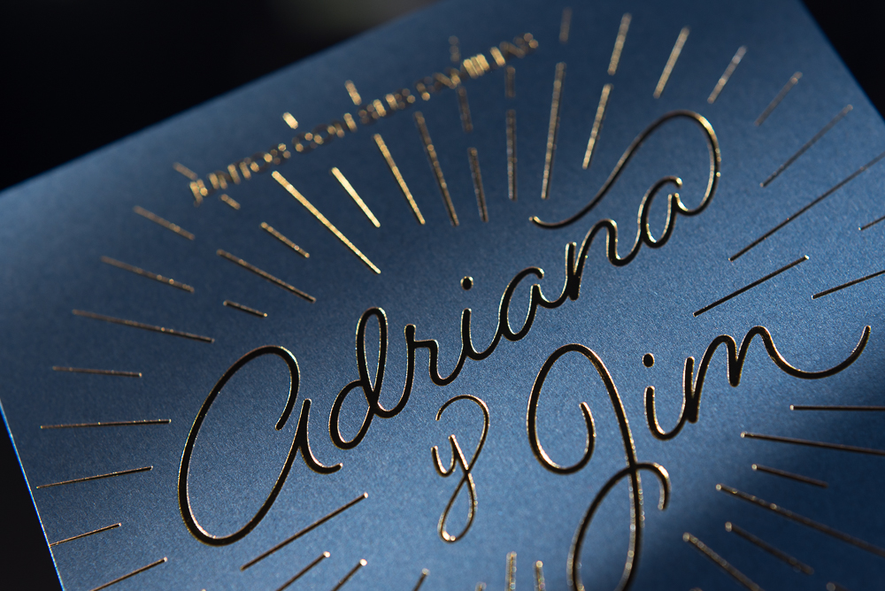 letterpress printed gold foil on blue paper wedding invite