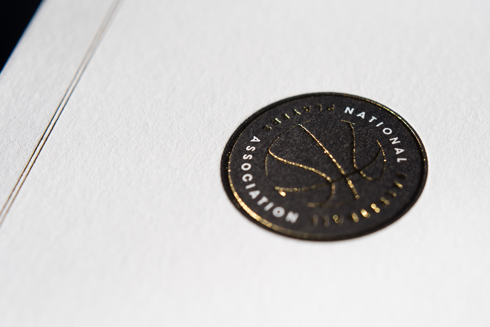 letterpress printed notecard with gold foil and black ink for NBPA
