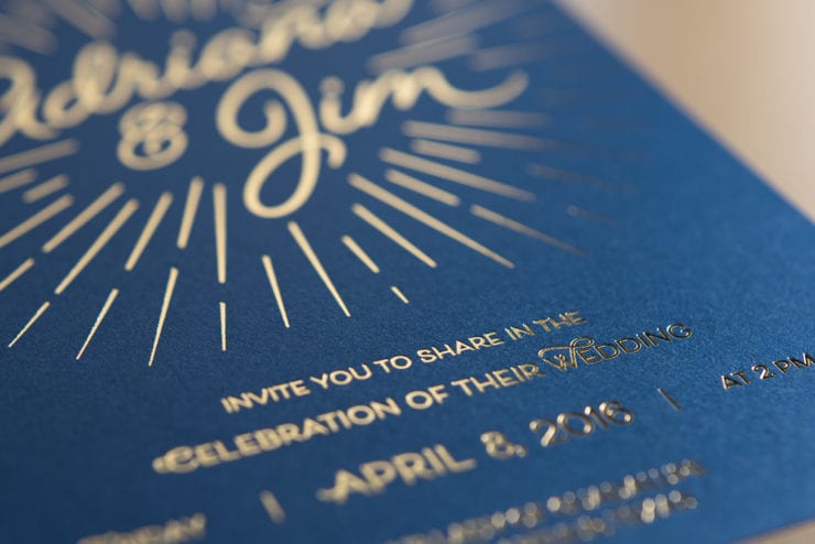 letterpress gold foil on blue paper wedding invitation