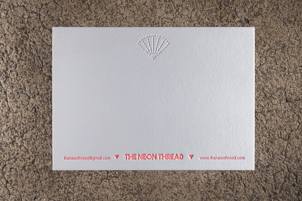 letterpress notecard on heavy white paper, blind deboss with neon ink