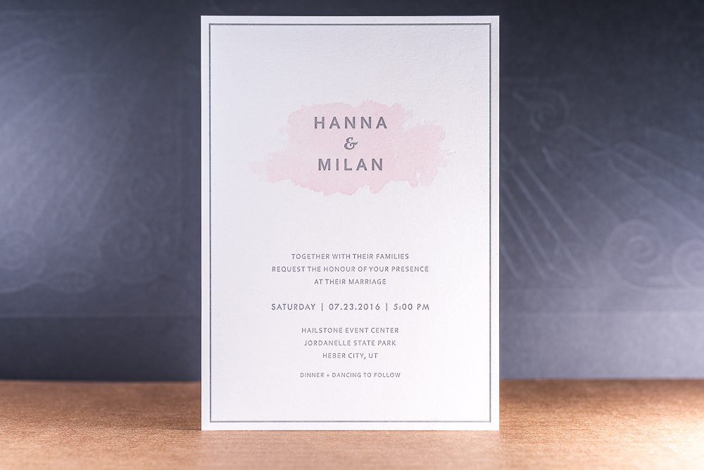 letterpress printed wedding invitation with pink watercolor effect