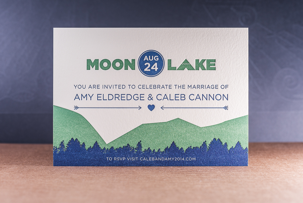 two color letterpress printed wedding invitation with mountains and trees on pearl lettra