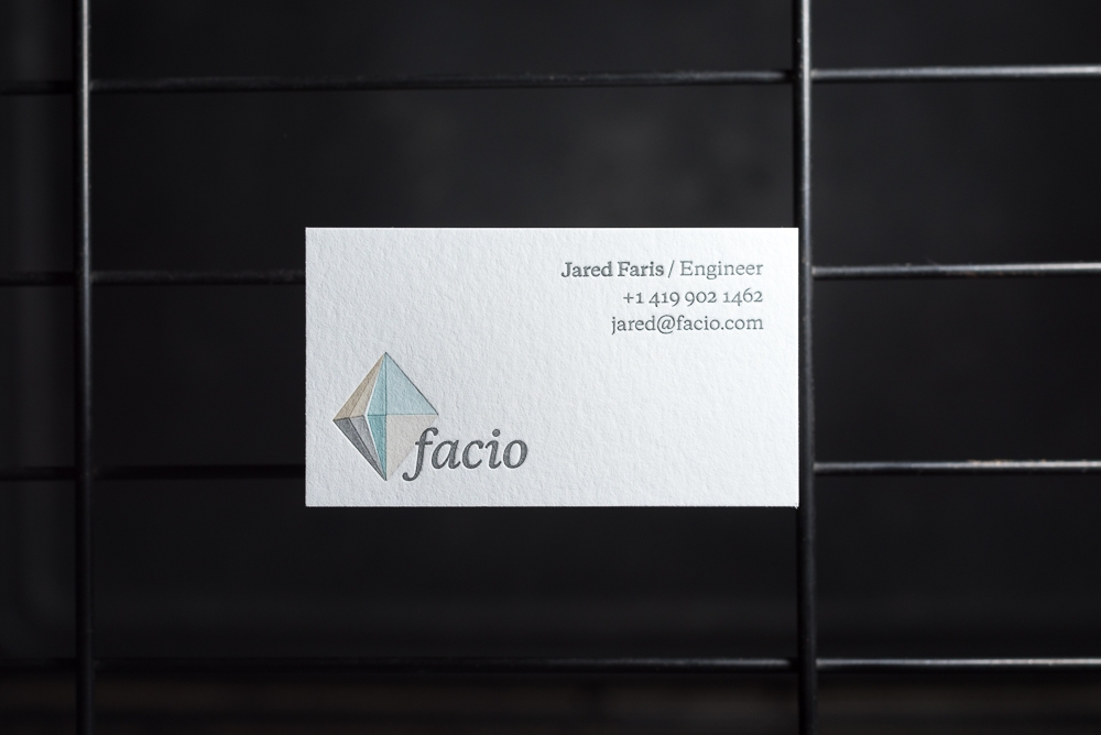 Multiple color overprint logo letterpress business card for facio