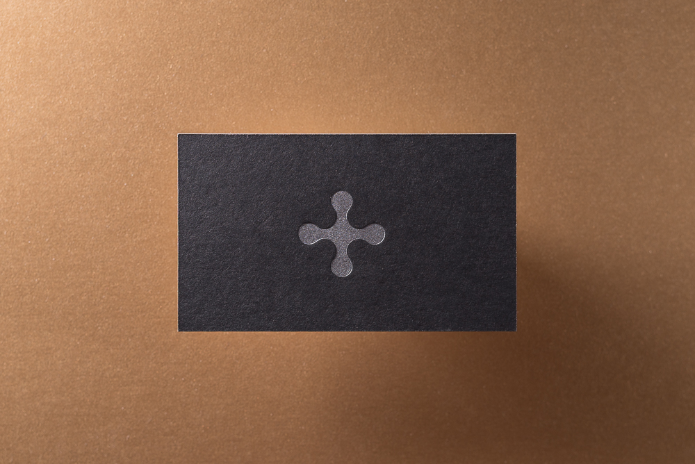 letter press business card on black paper with silver ink