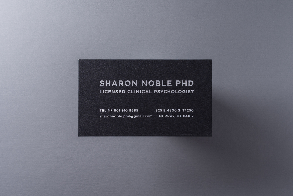 business card with white foil on black paper